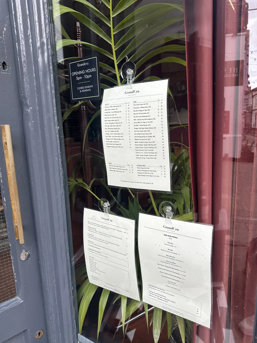 The slate-grey GrandCru shopfront on North Parade Avenue, with menu cards in the window