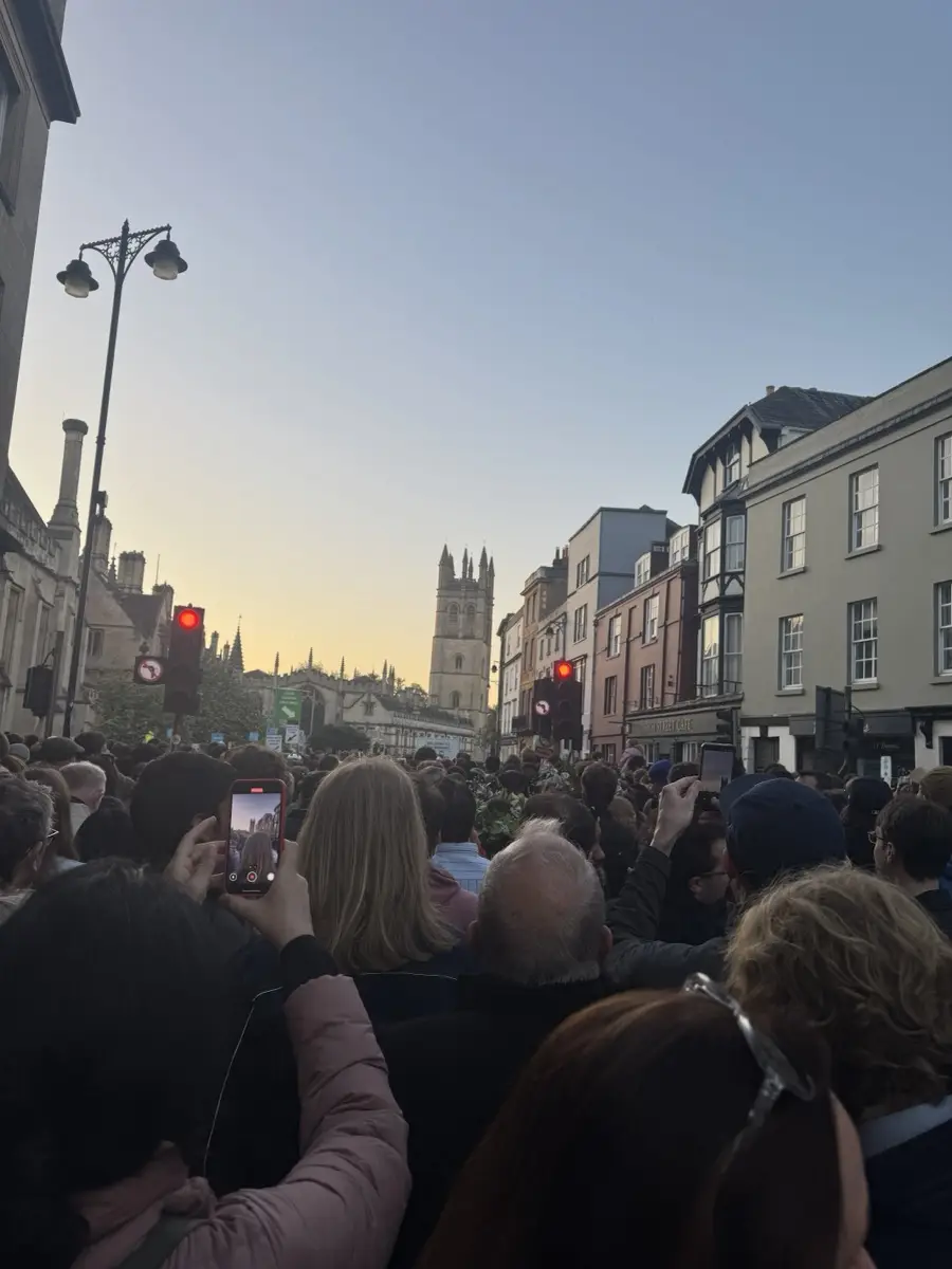 Magdalen Tower in dawn light at the head of the High Street, May Morning 2026